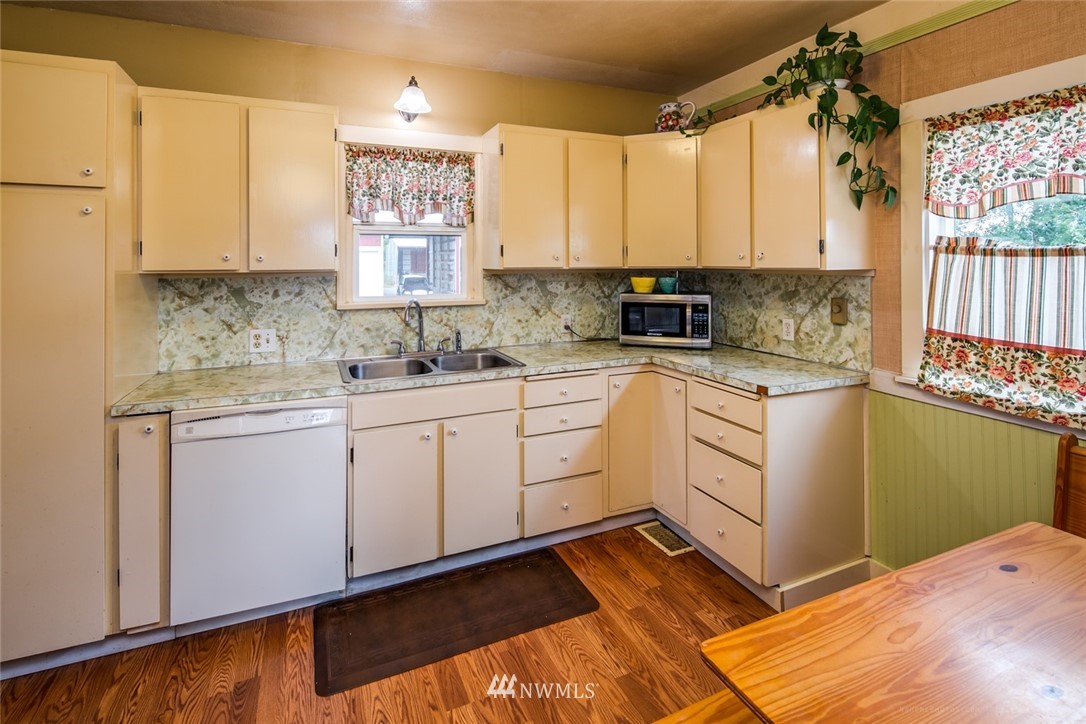 7332 Nooksack Road Everson, WA 98247 - Photo 9 of 33 a kitchen with a sink cabinets and window