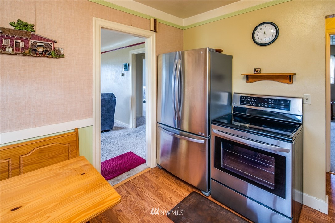 7332 Nooksack Road Everson, WA 98247 - Photo 10 of 33 a kitchen with stainless steel appliances granite countertop a refrigerator and a stove