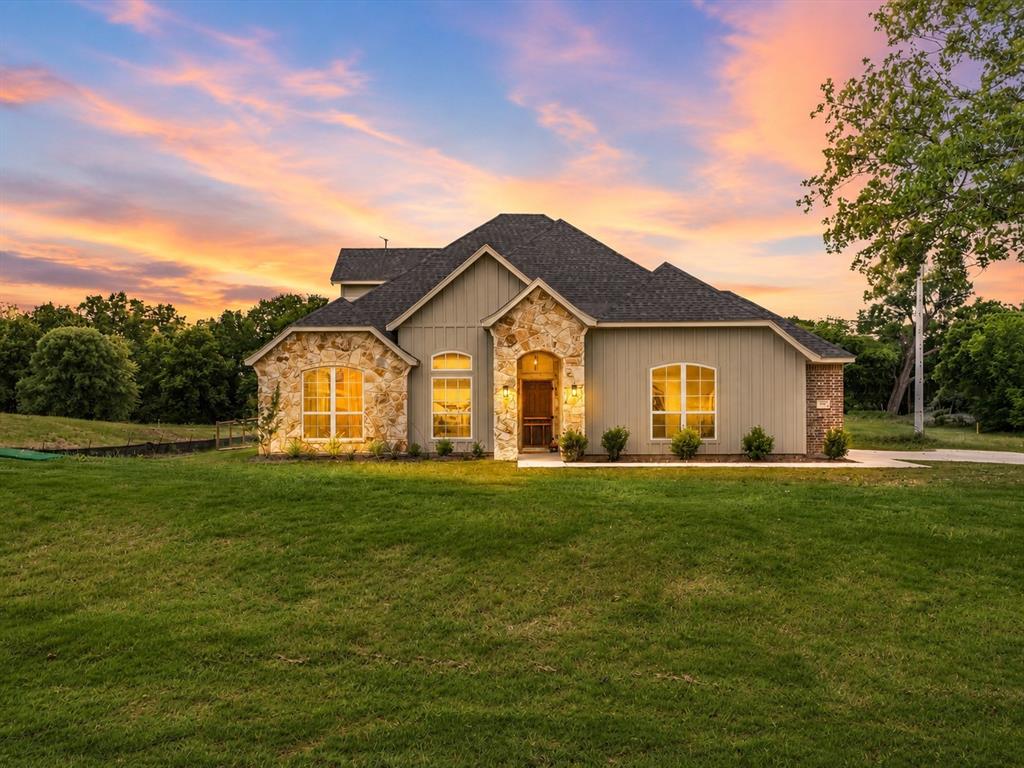 155 Rj Smith Drive Boyd, TX 76023 - Photo 1 of 38 Beautiful modern farmhouse situated on a premium 1.76-acre homesite in Boyd with timeless curb appeal, mature landscaping, and no HOA.