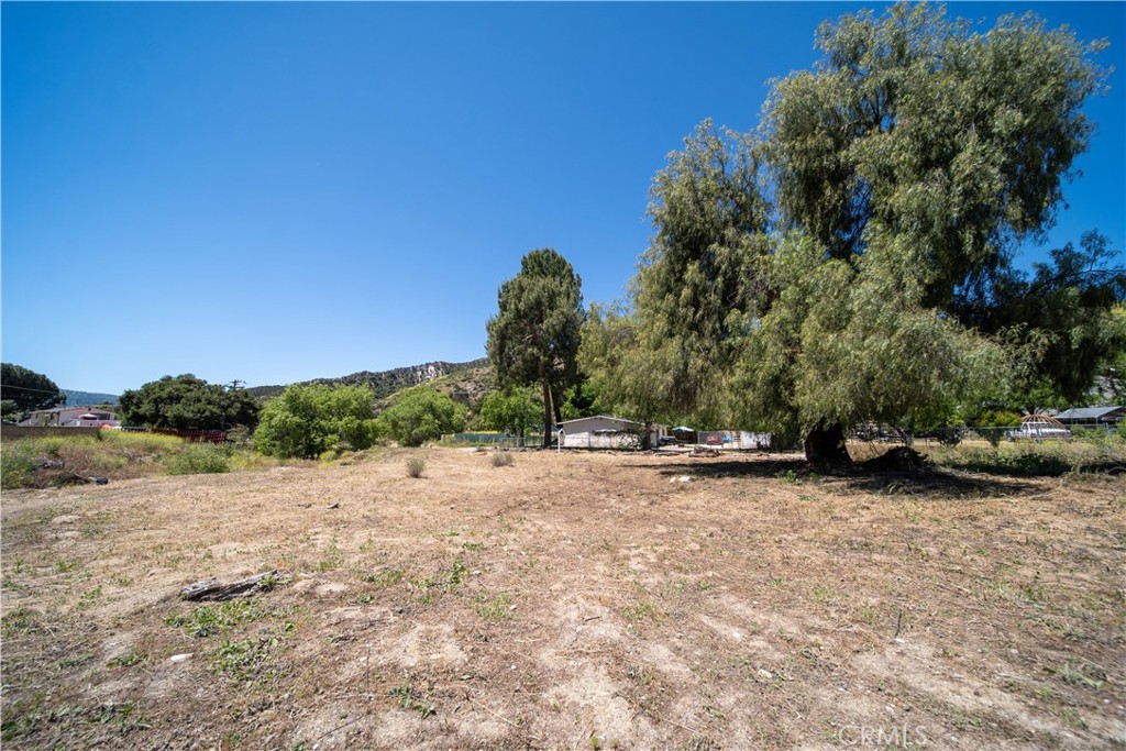 0 Taft Val Verde, CA 91384 - Photo 16 of 19 a view of a street with a trees