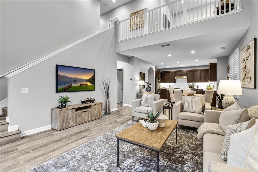 107 Copeland Irvine, CA 92618 - Photo 12 of 30 a living room with furniture and a flat screen tv