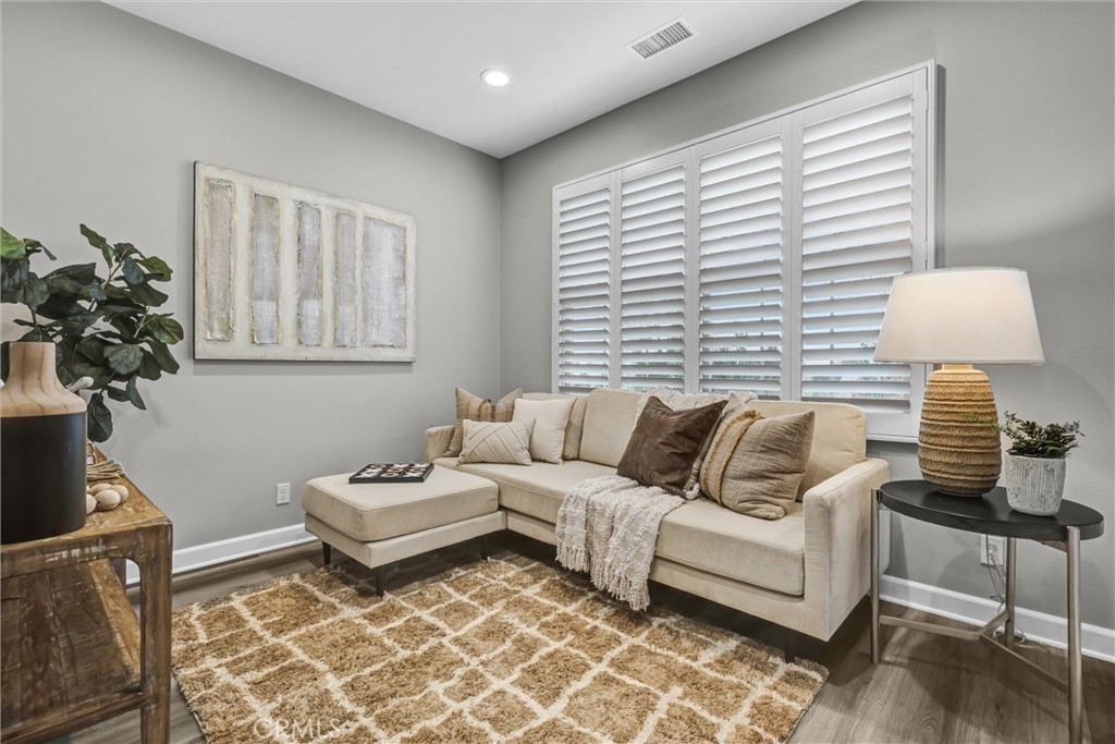 107 Copeland Irvine, CA 92618 - Photo 15 of 30 a living room with furniture and a lamp