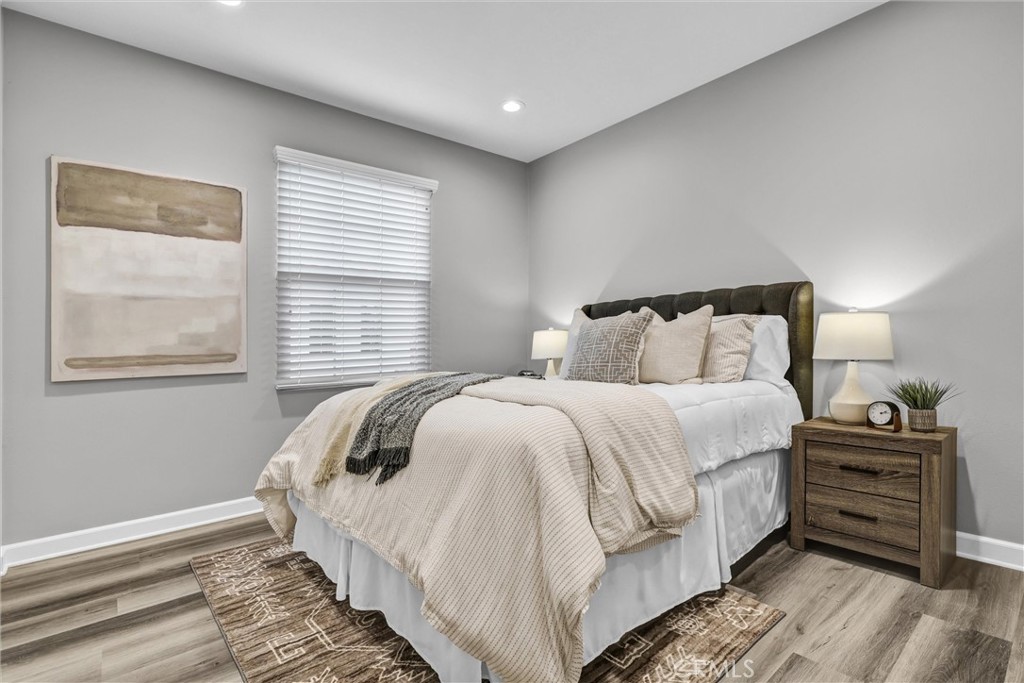 107 Copeland Irvine, CA 92618 - Photo 17 of 30 a bedroom with a bed and a window
