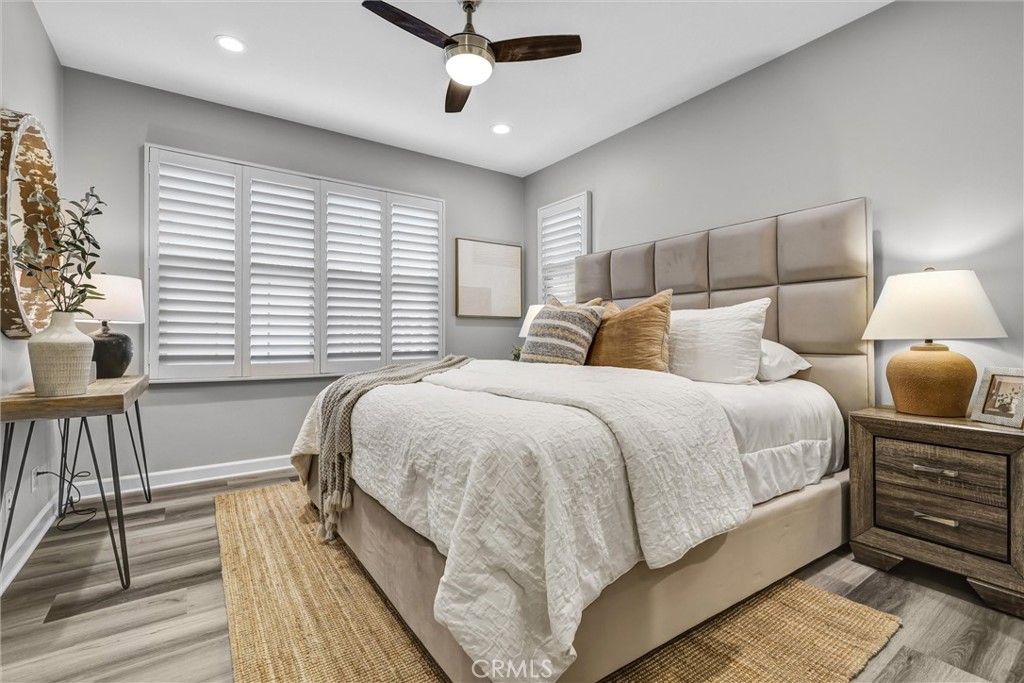 107 Copeland Irvine, CA 92618 - Photo 20 of 30 a bedroom with a bed and a large window