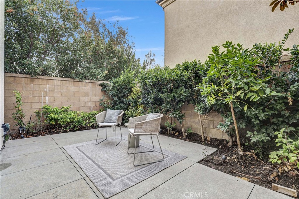 107 Copeland Irvine, CA 92618 - Photo 27 of 30 a view of backyard with plants and outdoor seating