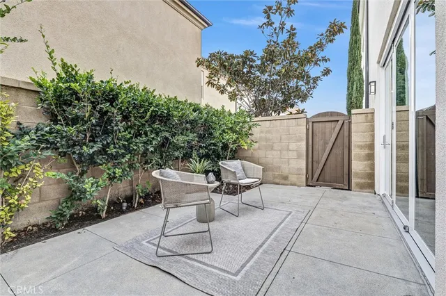 a white bench sitting in front of a building