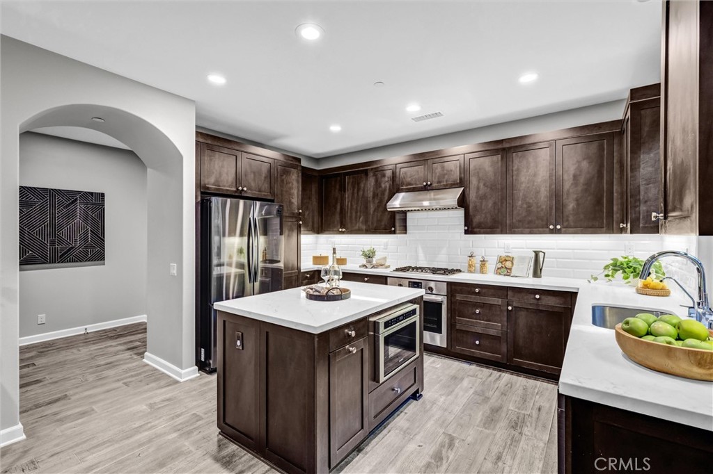 107 Copeland Irvine, CA 92618 - Photo 7 of 30 a kitchen with sink a stove and refrigerator