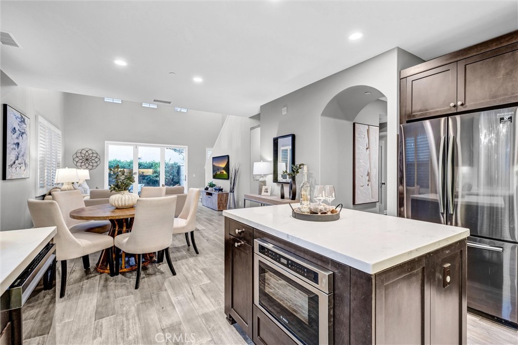 107 Copeland Irvine, CA 92618 - Photo 8 of 30 a view of a dining room with furniture window and wooden floor