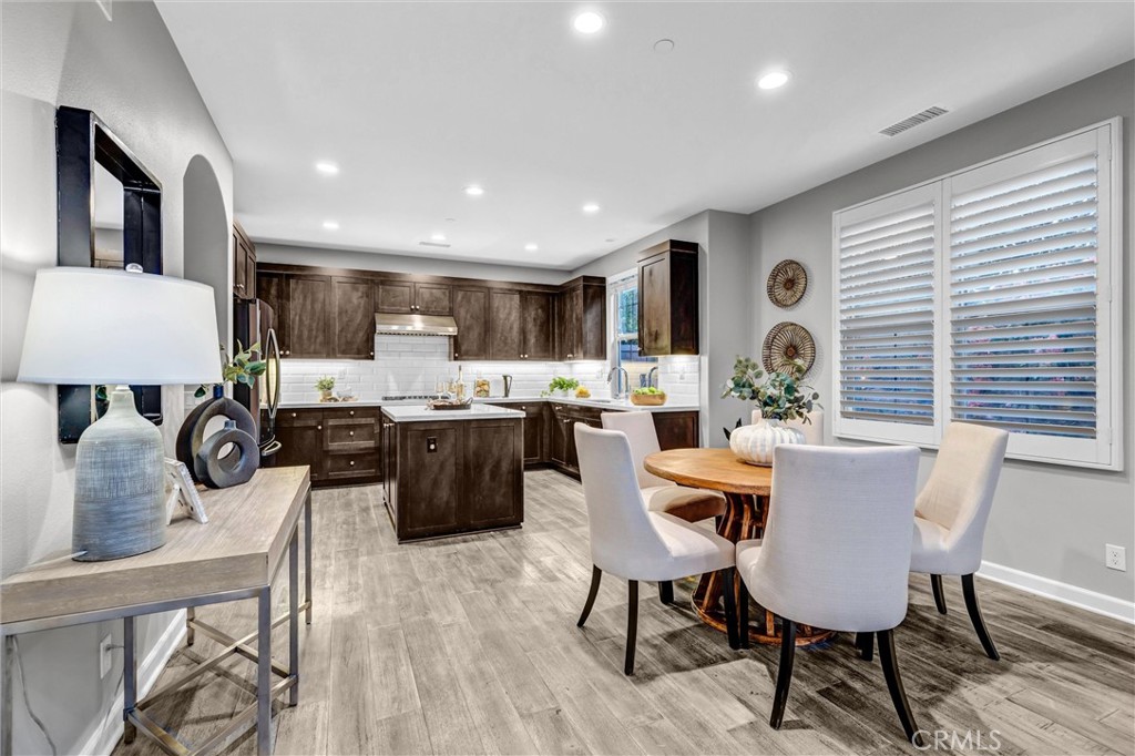 107 Copeland Irvine, CA 92618 - Photo 10 of 30 a living room with furniture and kitchen view