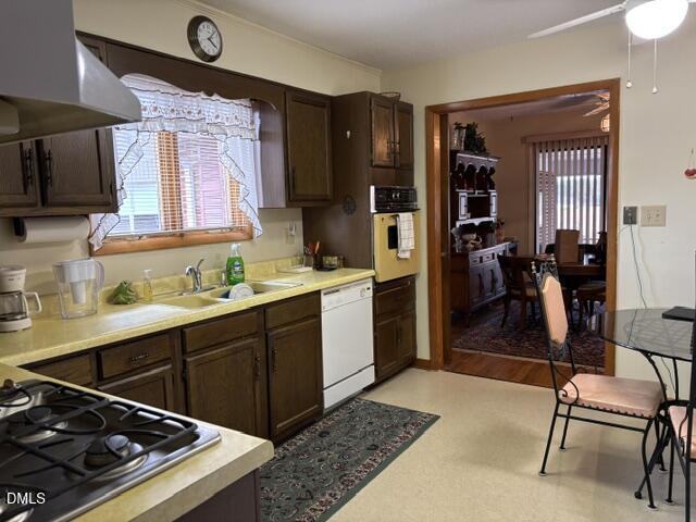 1241 Macon-Embro Road Macon, NC 27551 - Photo 4 of 11 a kitchen with a sink stove and refrigerator
