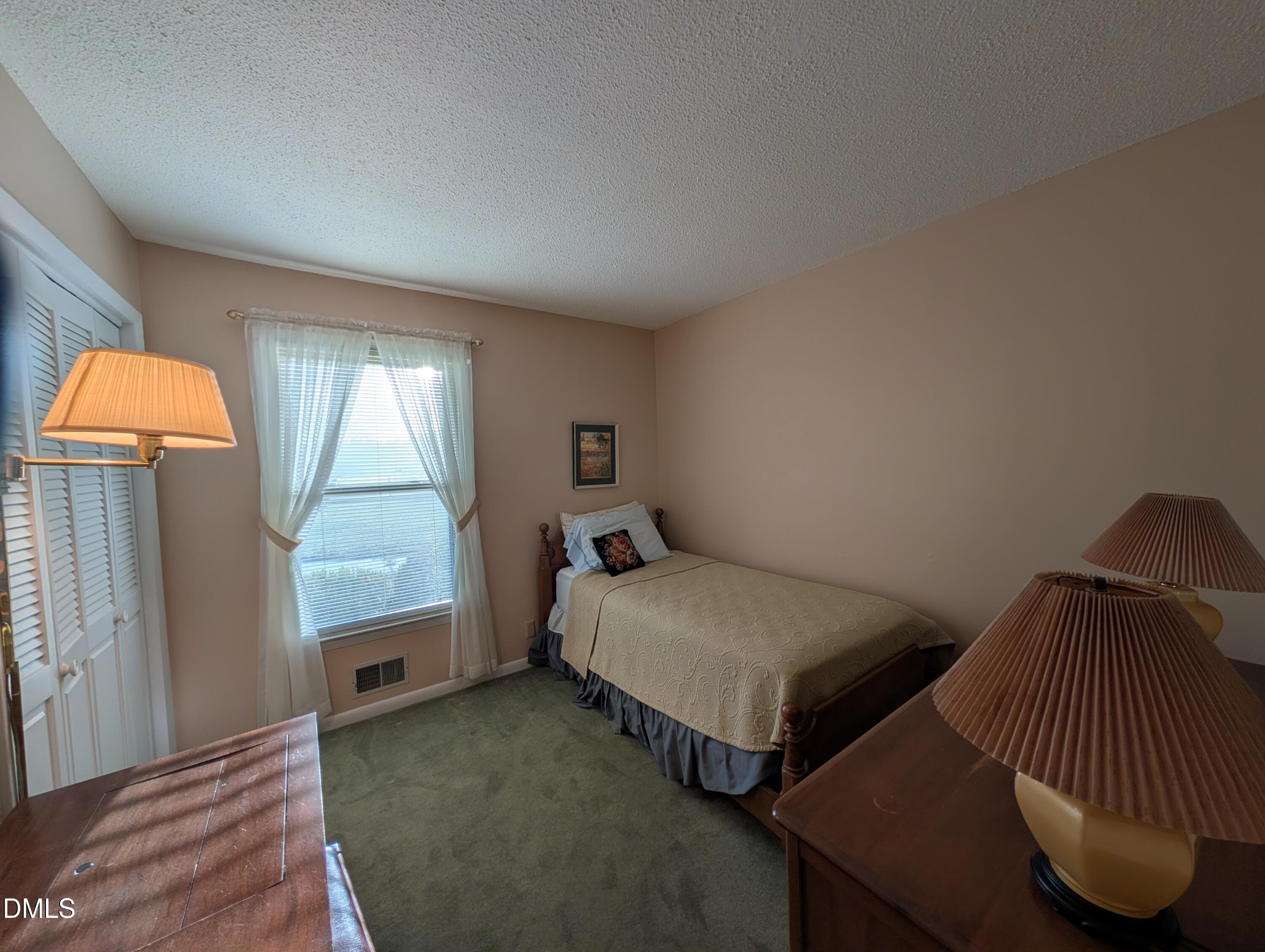 1241 Macon-Embro Road Macon, NC 27551 - Photo 7 of 11 a bedroom with two beds and a window