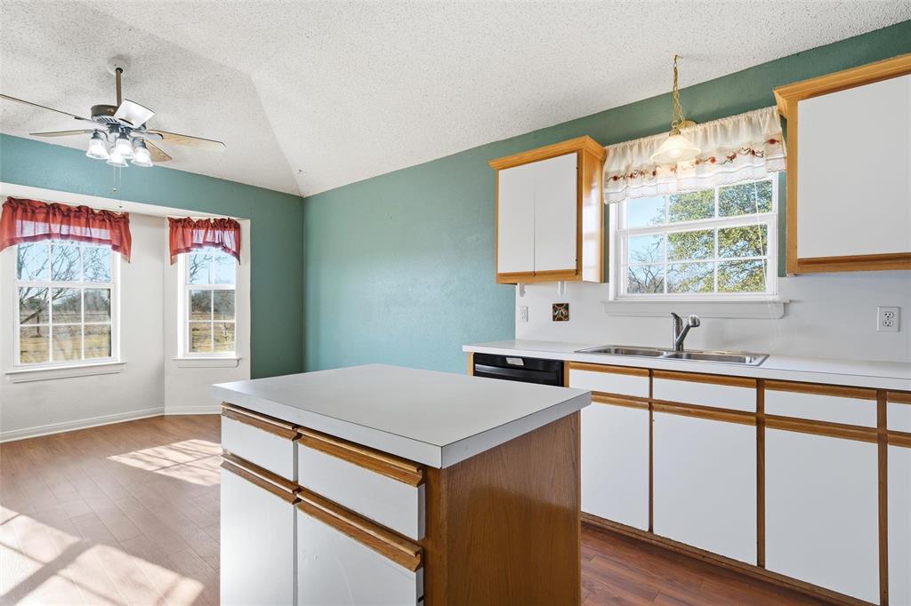 155 Rabajo Road China Spring, TX 76633 - Photo 11 of 40 a kitchen with a stove a sink and a window