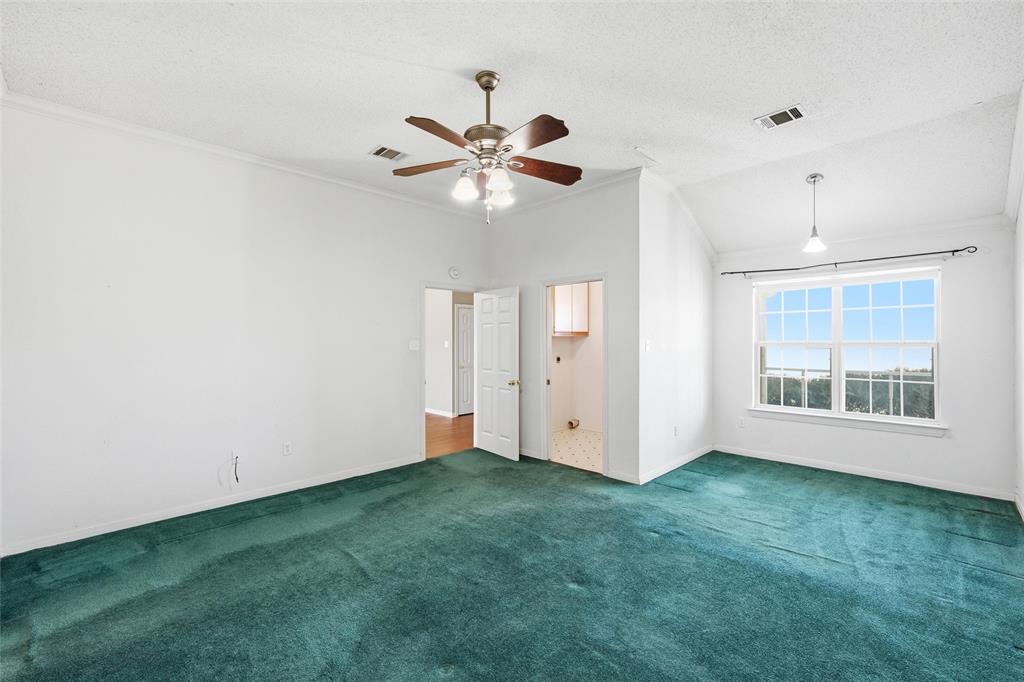 155 Rabajo Road China Spring, TX 76633 - Photo 13 of 40 a view of an empty room with window and chandelier fan