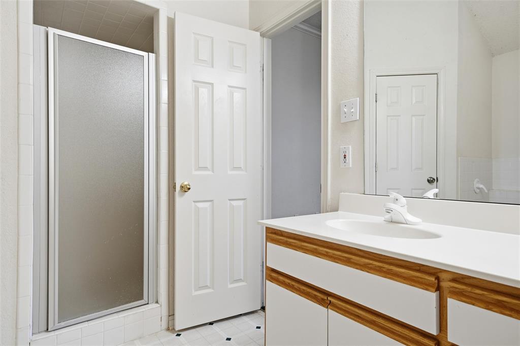 155 Rabajo Road China Spring, TX 76633 - Photo 17 of 40 a bathroom with a sink and a mirror