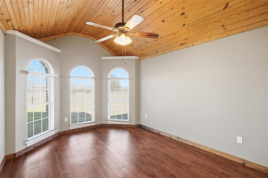 155 Rabajo Road China Spring, TX 76633 - Photo 18 of 40 an empty room with wooden floor fan and windows