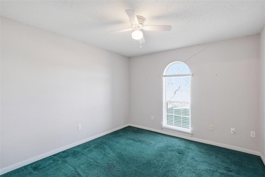 155 Rabajo Road China Spring, TX 76633 - Photo 21 of 40 an empty room with a window and a fan