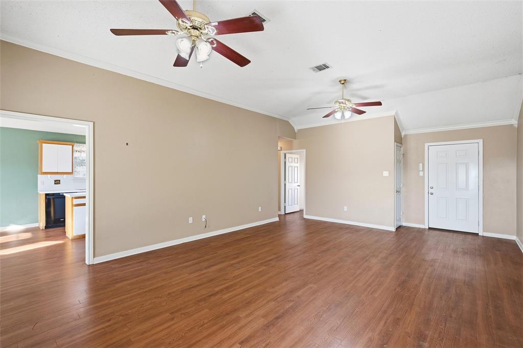155 Rabajo Road China Spring, TX 76633 - Photo 4 of 40 wooden floor in an empty room with a window