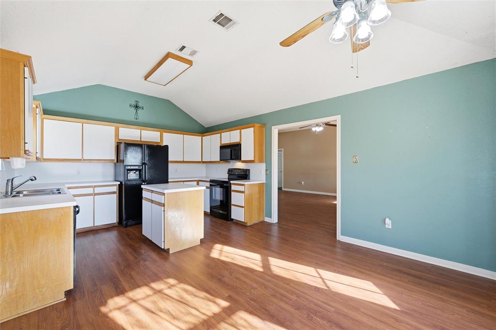 155 Rabajo Road China Spring, TX 76633 - Photo 8 of 40 a kitchen with a refrigerator and a sink