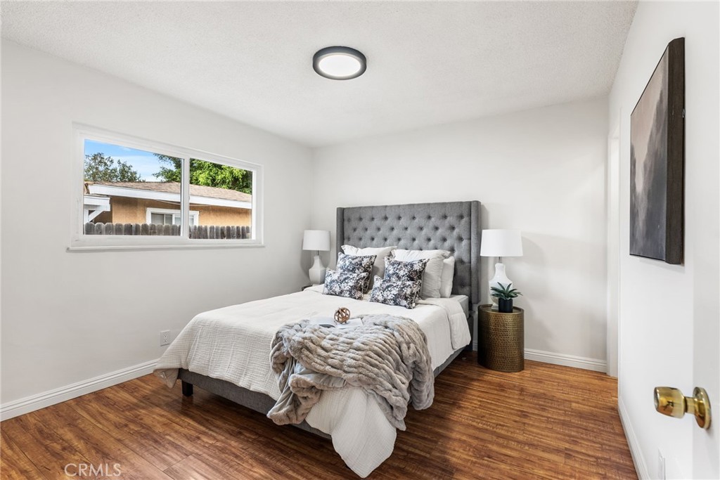 13361 Roxey Drive Garden Grove, CA 92843 - Photo 12 of 31 a bedroom with a bed and a window
