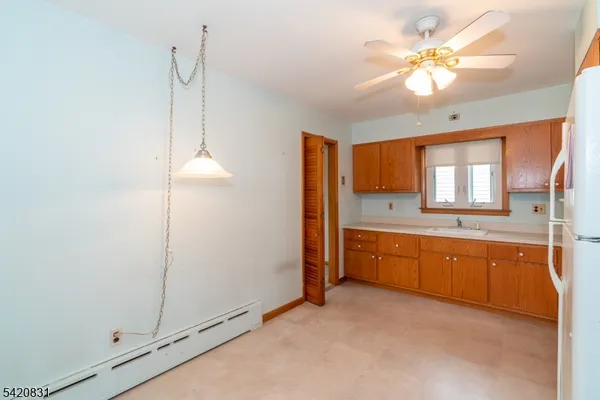 a large bathroom with a large tub sink and mirror