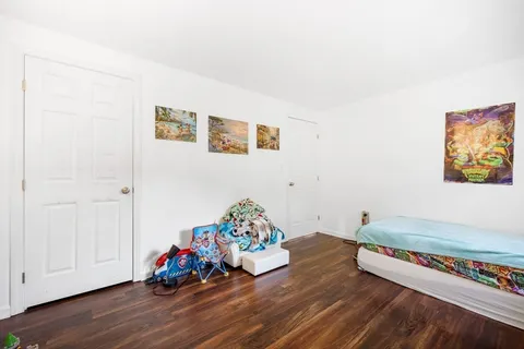 a room with toys and wooden floor