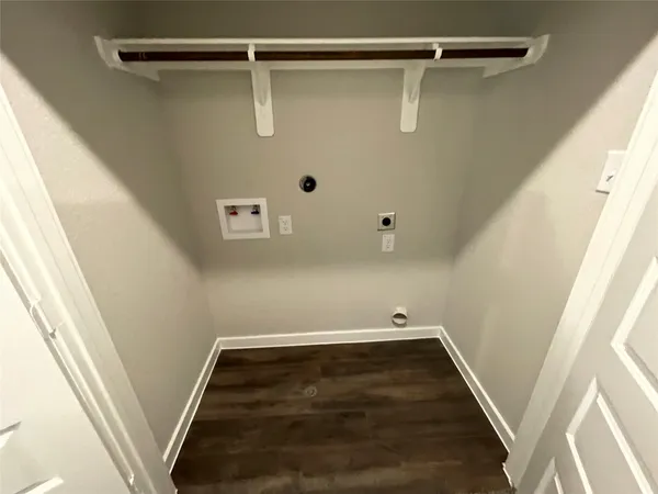 a view of room with wooden floor