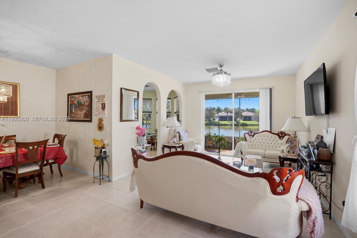 337 Southwest Maclay Way Port St. Lucie, FL 34986 - Photo 13 of 52 a living room with furniture and a large window