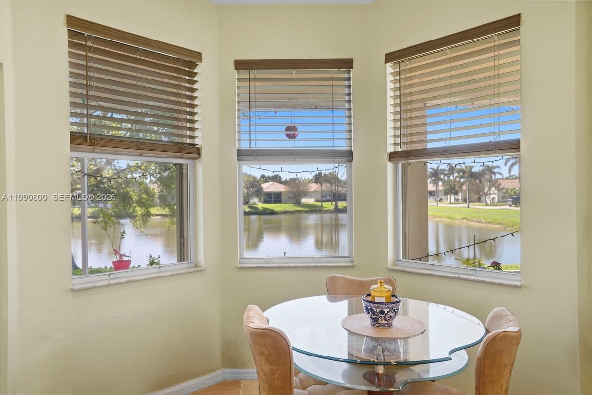 337 Southwest Maclay Way Port St. Lucie, FL 34986 - Photo 17 of 52 a dining room with furniture and wooden floor