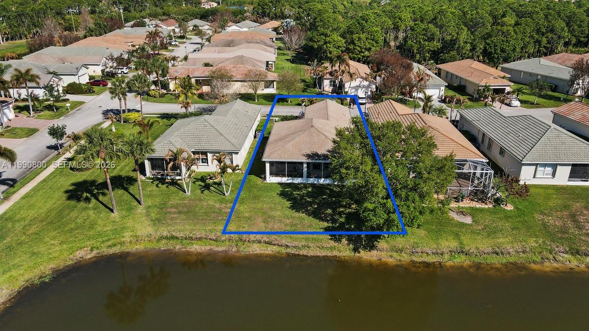 337 Southwest Maclay Way Port St. Lucie, FL 34986 - Photo 32 of 52 an aerial view of multiple houses with yard