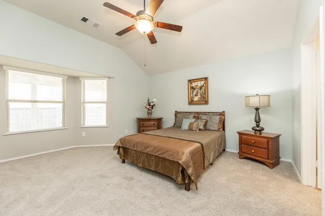 a bedroom with a bed and a walk in closet