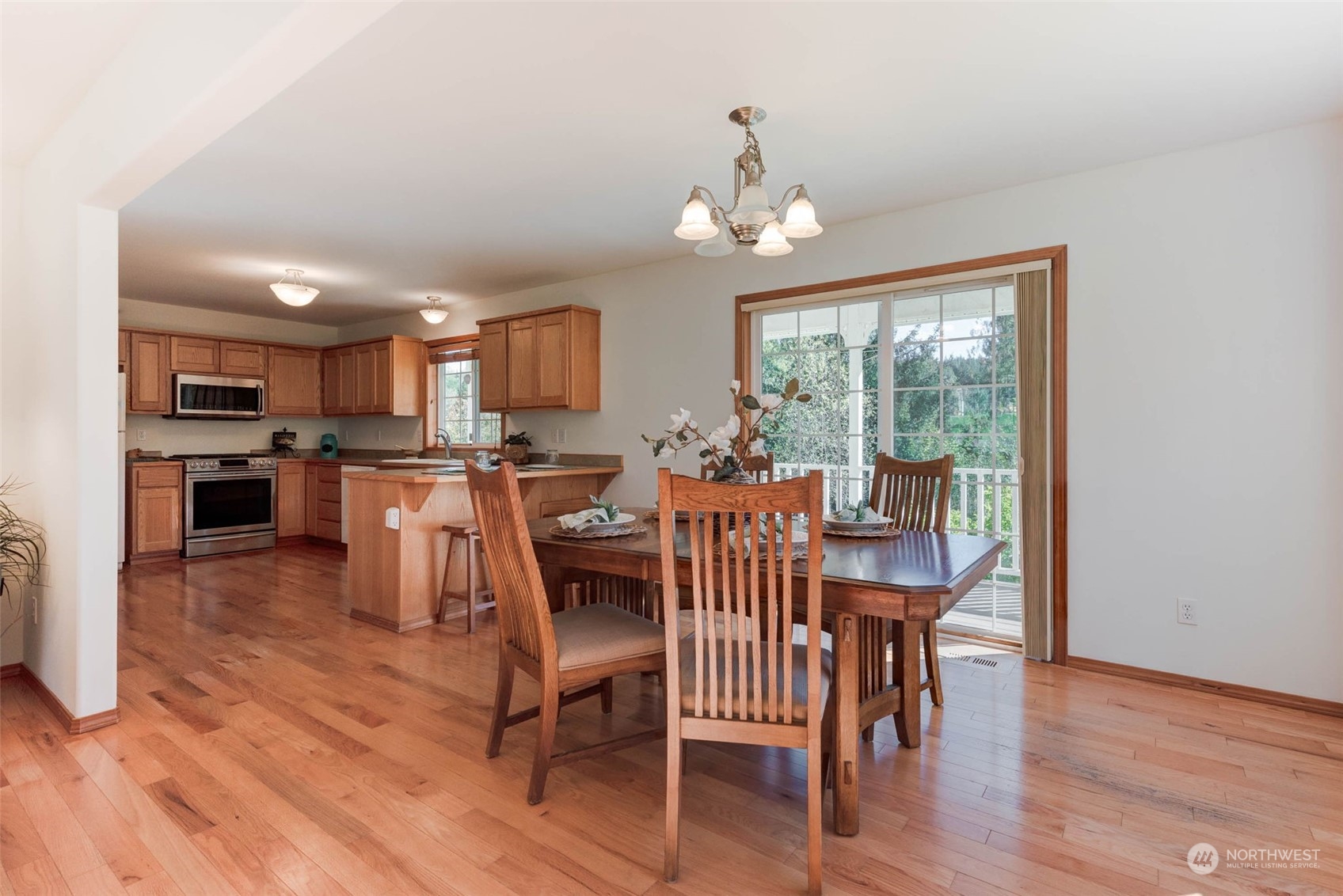 11 North Carpenter Road Snohomish, WA 98290 - Photo 6 of 38 a view of a dining room with furniture window and wooden floor