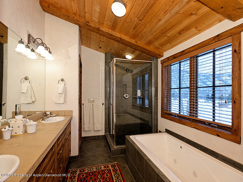 19 Arbaney Ranch Road Basalt, CO 81621 - Photo 11 of 20 a bathroom with a granite countertop sink and a large mirror