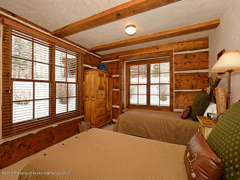 19 Arbaney Ranch Road Basalt, CO 81621 - Photo 14 of 20 a bedroom with a bed and a large window