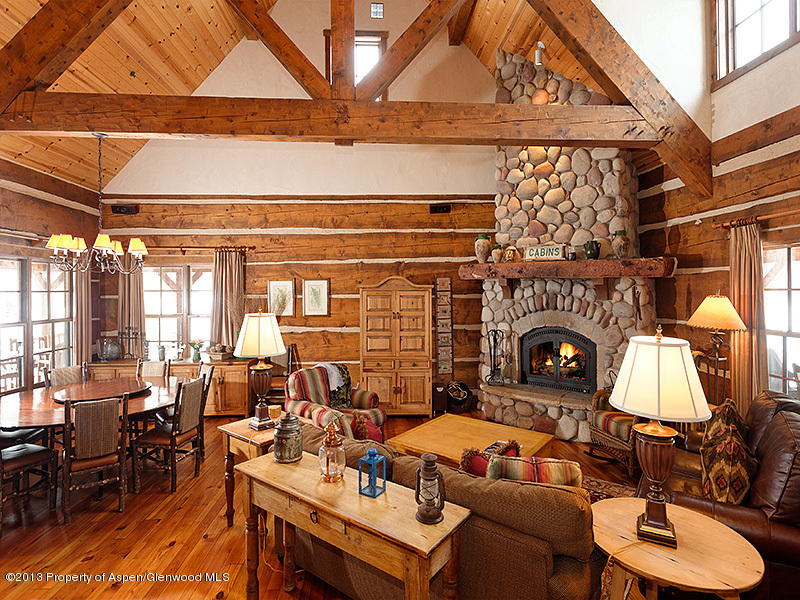 19 Arbaney Ranch Road Basalt, CO 81621 - Photo 3 of 20 a living room with furniture a fireplace and a table