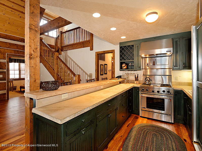 19 Arbaney Ranch Road Basalt, CO 81621 - Photo 6 of 20 a kitchen with stainless steel appliances kitchen island a stove and a sink