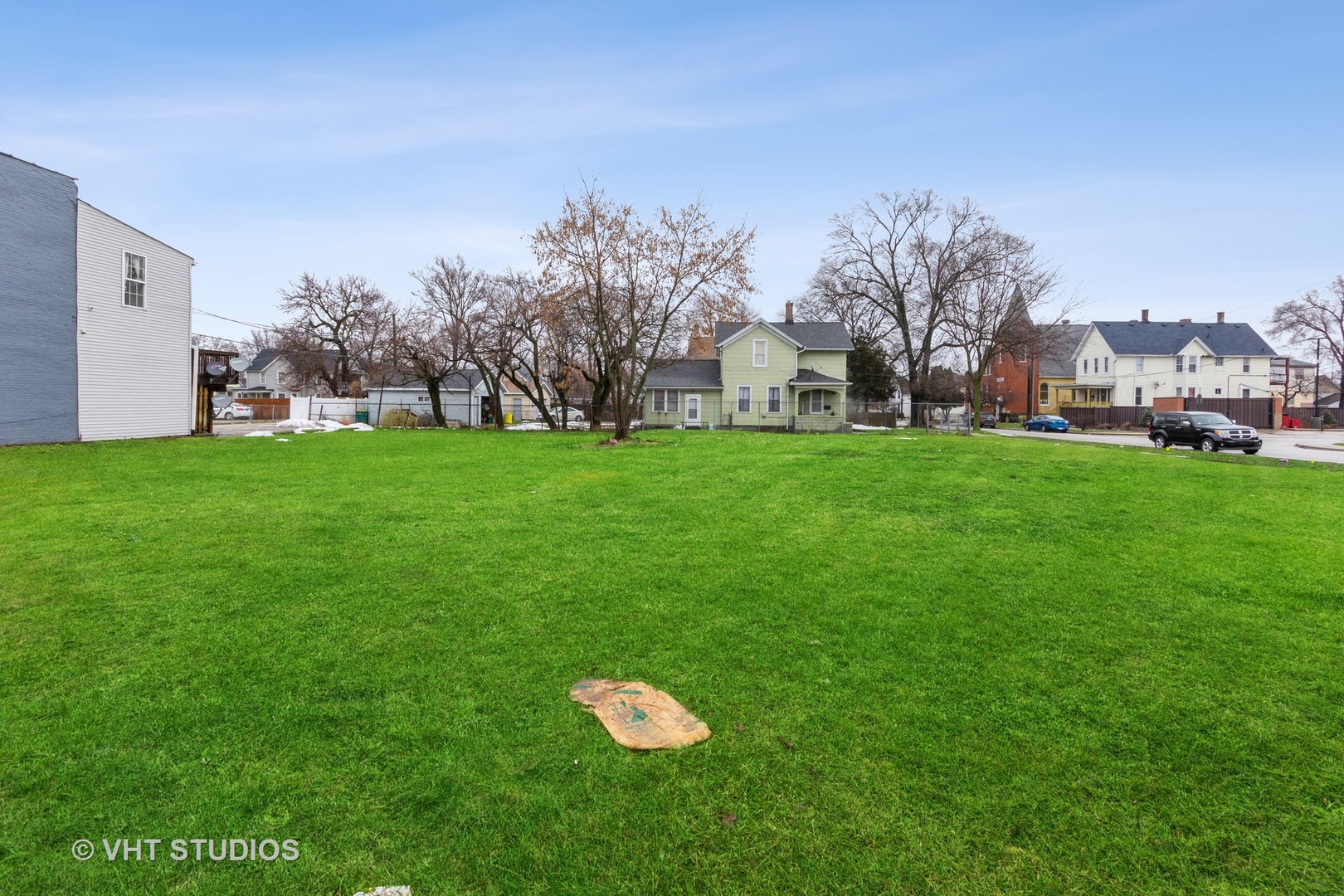 456 Collins Street Joliet, IL 60432 - Photo 6 of 8 a house with a big yard and large trees