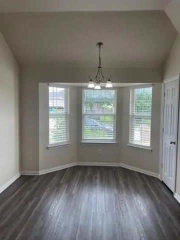 a view of a room with windows