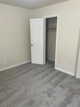 a bathroom with a bathtub and a toilet