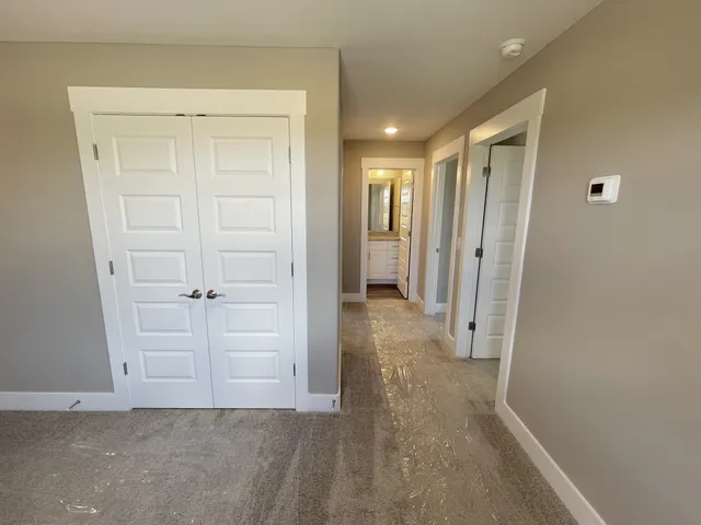 a view of a hallway with closet area