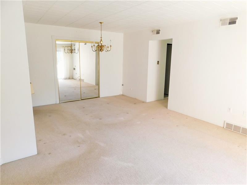 205 Coraopolis Road, Unit C6 Coraopolis, PA 15108 - Photo 5 of 16 Dining Room With Large Mirrored Door Storage Closet