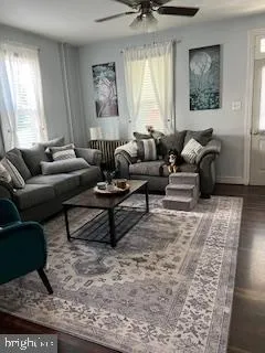 a living room with furniture or couch and a window