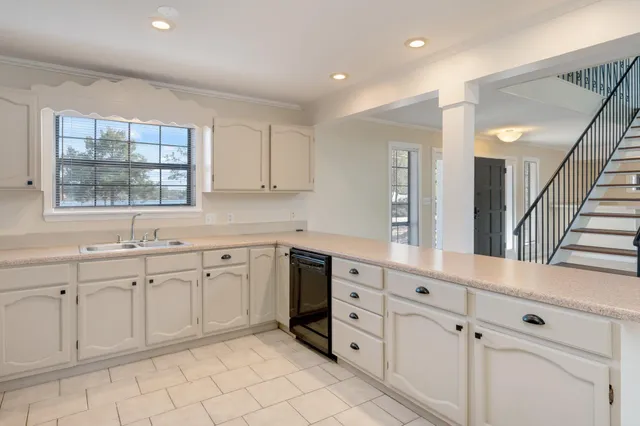 a kitchen with a sink and a window