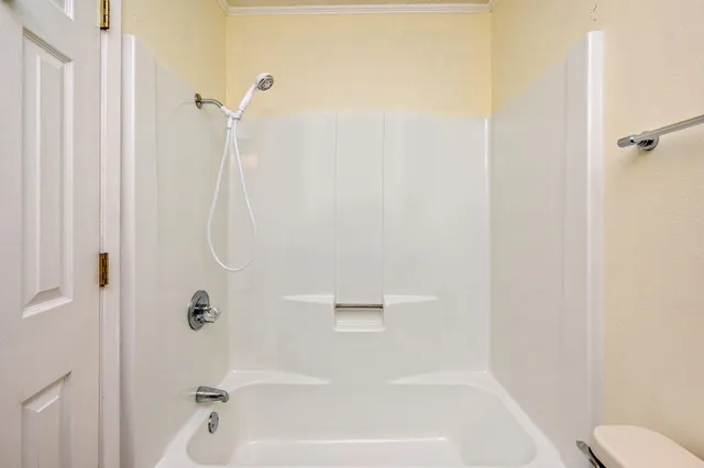 a kitchen with a refrigerator a washer and dryer