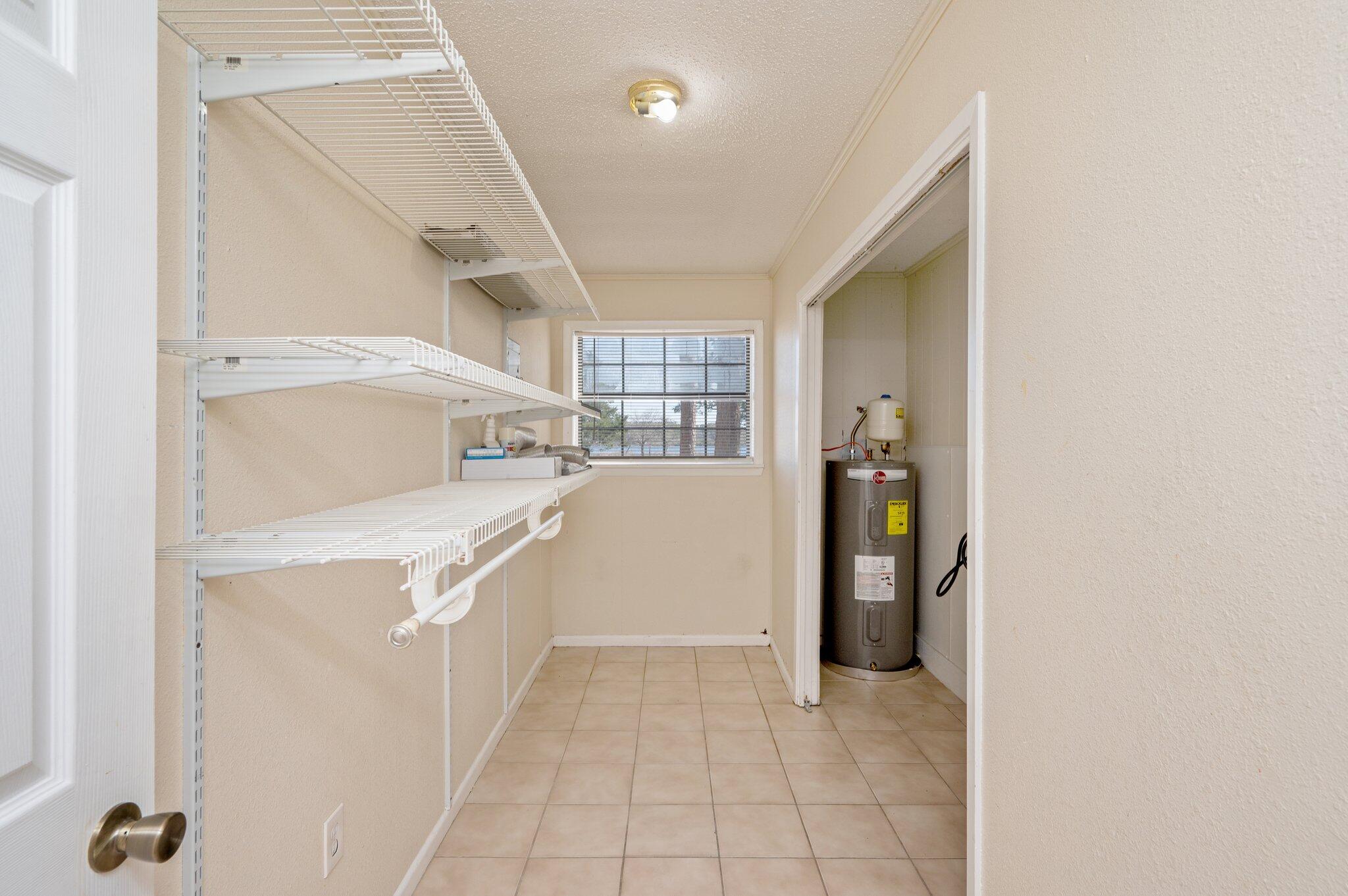 770 Lakeview Drive DeFuniak Springs, FL 32433 - Photo 19 of 32 a kitchen with a refrigerator a washer and dryer