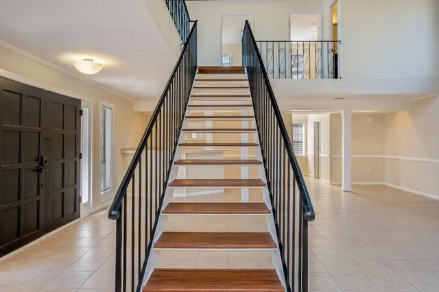 a view of hallway with wooden floor
