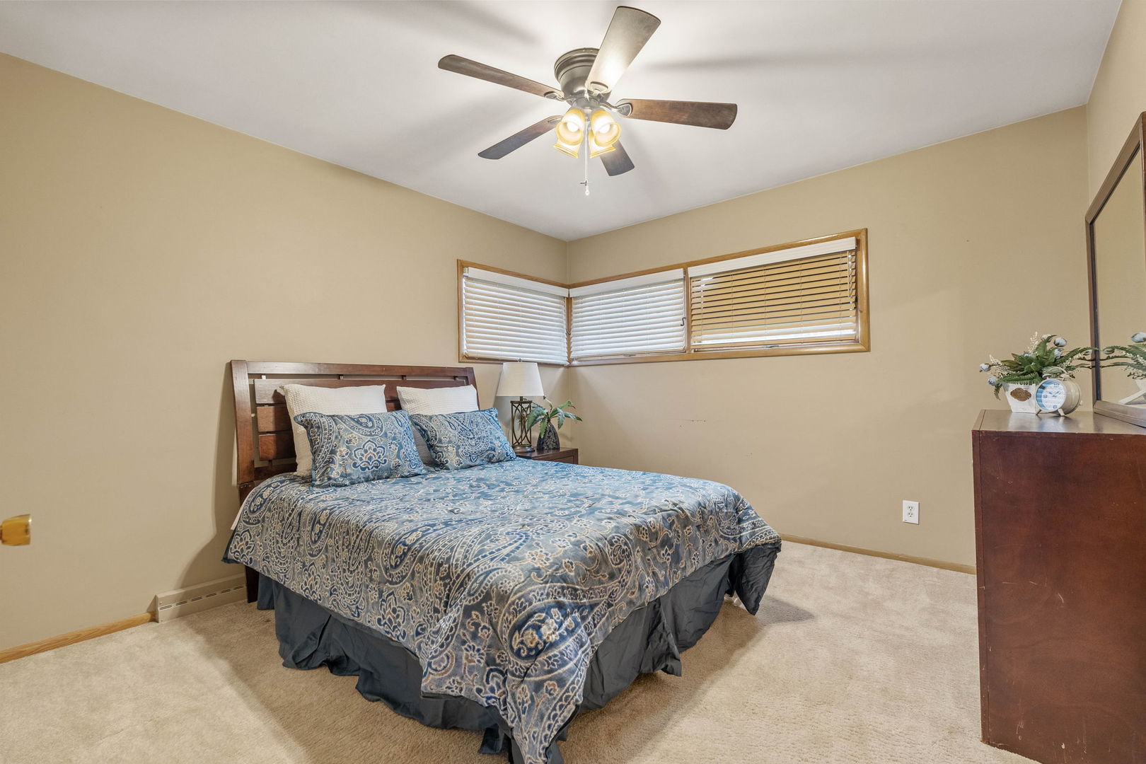 3103 15th Street A Moline, IL 61265 - Photo 13 of 33 a bedroom with a bed and a chandelier
