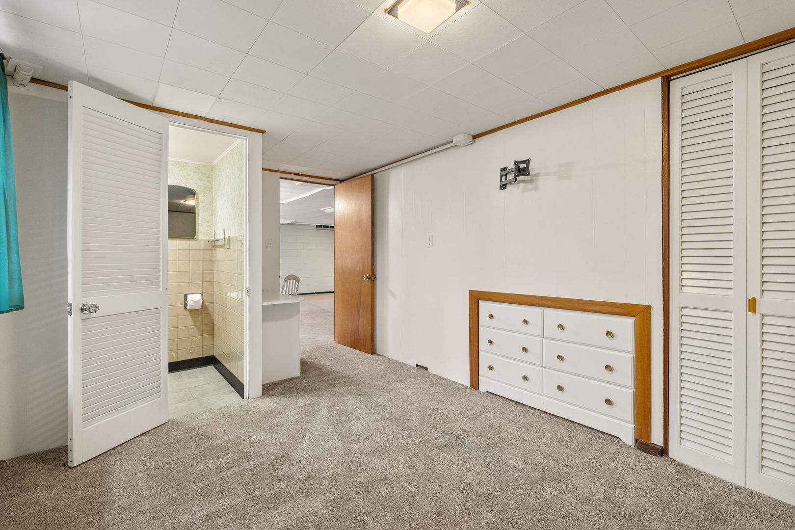 3103 15th Street A Moline, IL 61265 - Photo 17 of 33 a view of room with cabinet and a ceiling fan