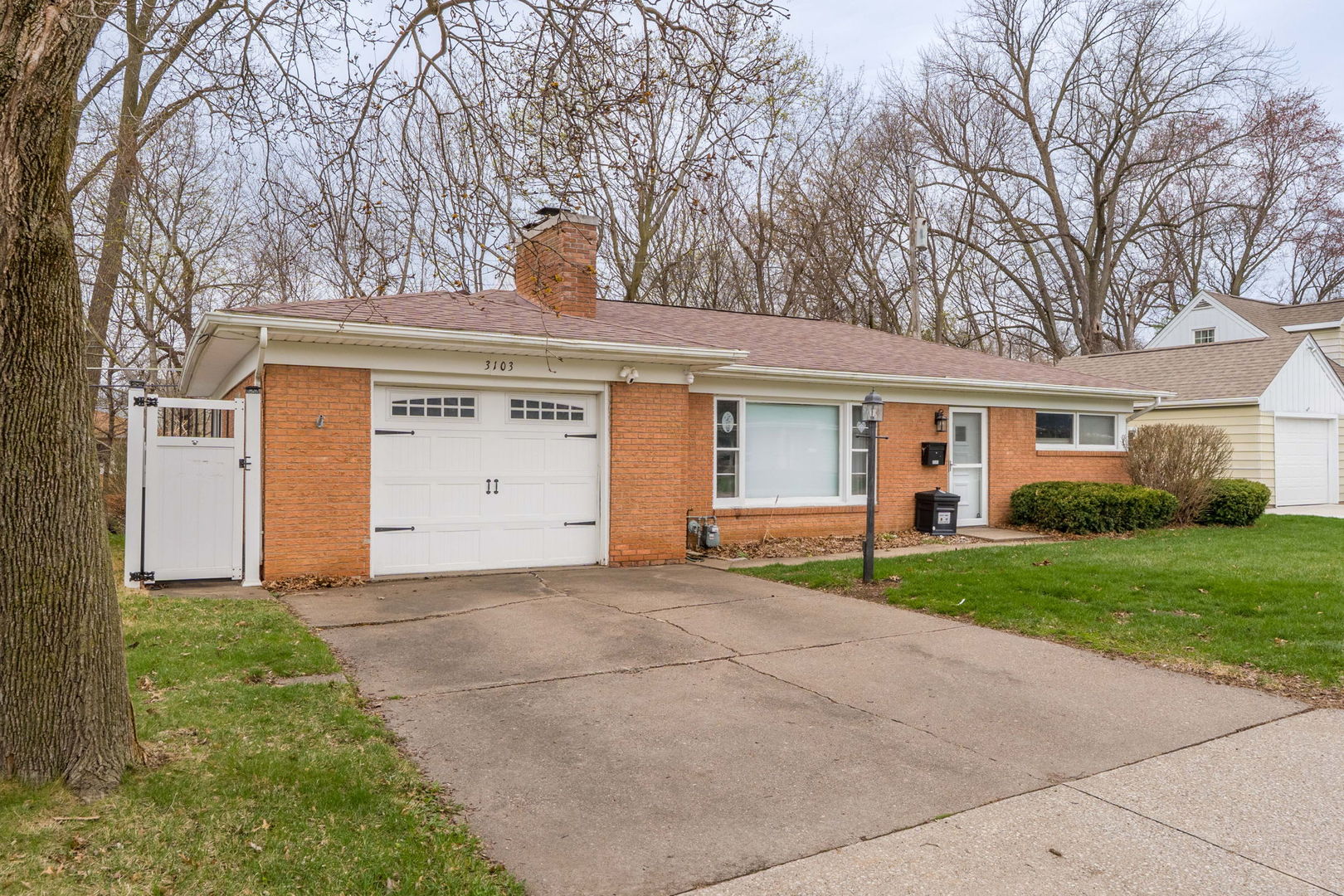 3103 15th Street A Moline, IL 61265 - Photo 2 of 33 a view of a house with a yard and garage