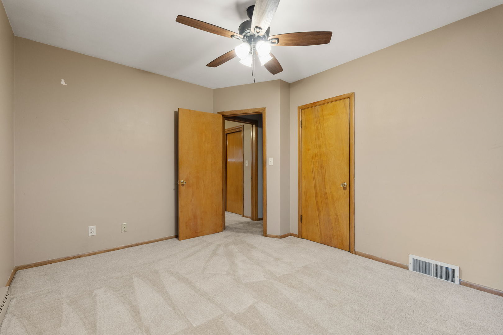 3103 15th Street A Moline, IL 61265 - Photo 24 of 33 a view of a livingroom with a chandelier fan