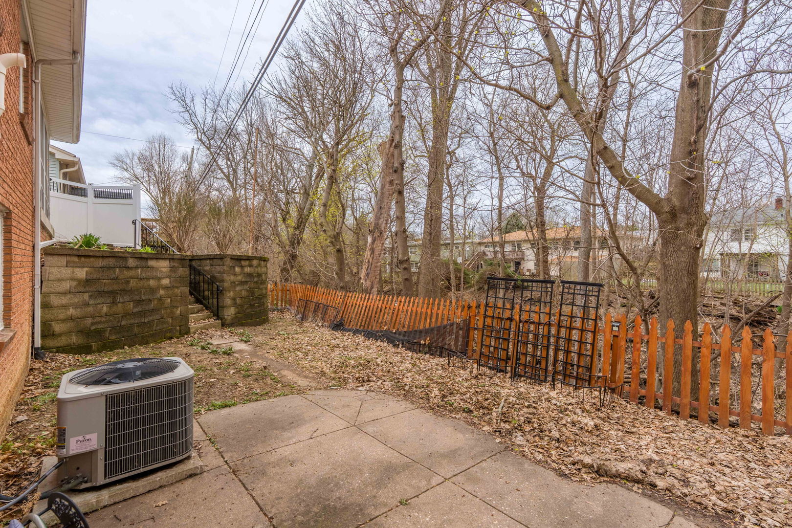3103 15th Street A Moline, IL 61265 - Photo 28 of 33 a view of a pathway with a bench in front of house
